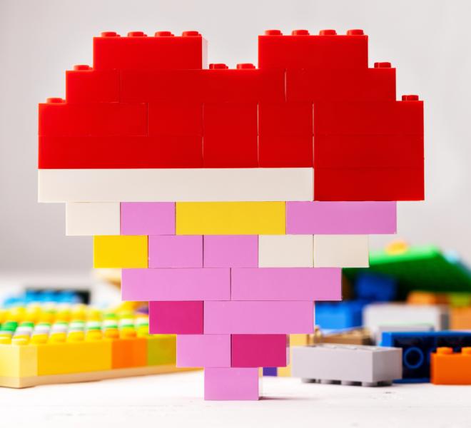 A heart shape made from colourful building block toys